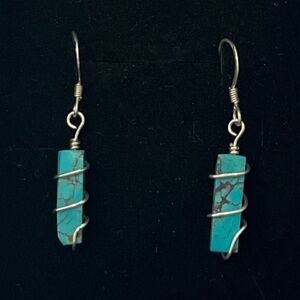 Sterling silver drop earrings. Turquoise stones. Blue green. Vibrant.